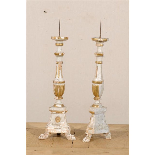 A Pair of Italian 19th Century Painted and Gilded Candlesticks on Tripod Feet.