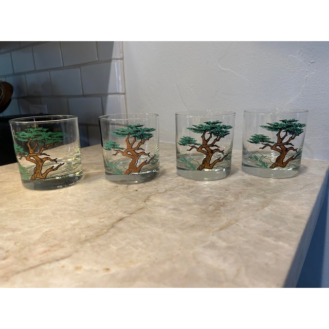 Set of four vintage Couroc of Monterey old fashioned glasses featuring the iconic windswept Monterey cypress motif. The...