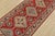 A tribal Caucasian Kazak runner hand-knotted with fine wool on a cotton foundation. This rug features a row of geometric...