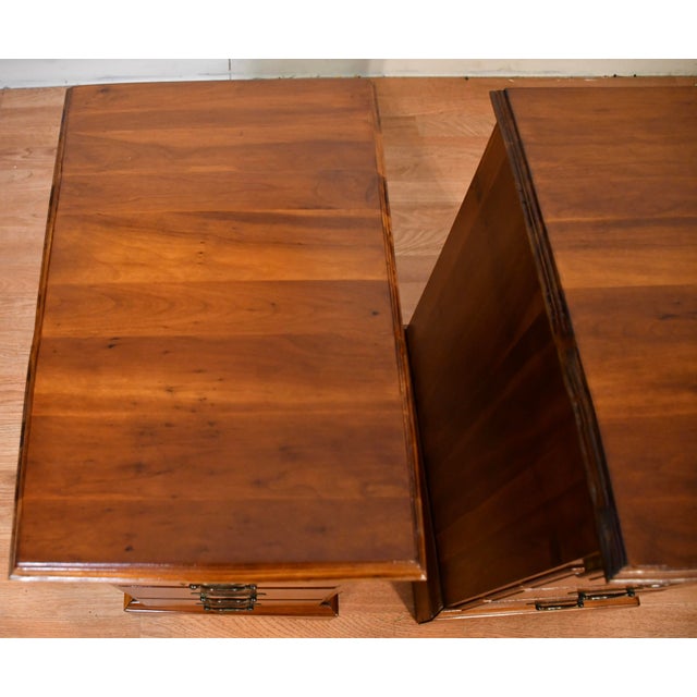 We are pleased to offer this beautiful pair of English Nightstands, from the 1930s. This pair is made of Cedar wood, one...