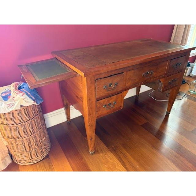 The Antique Walnut Leather Top French Writing Desk is a stunning piece of furniture from the early 19th century,...