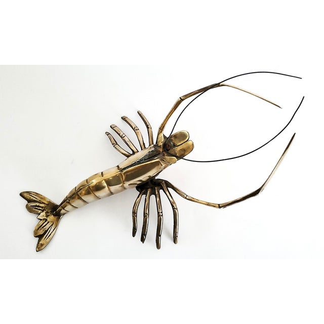 Offering a vintage polished solid brass lobster table or wall sculpture, circa 1960s. This sculpture, which is a nice size...