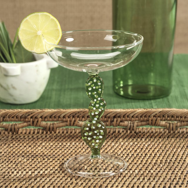 Elevate your cocktail experience with the Climbing Cacti Tequila Cocktail Glasses. Featuring a classic clear-finish coupe...