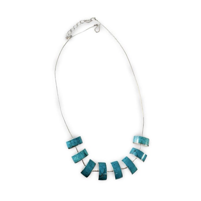 Unique Sterling Silver and Turquoise necklace. The 19” necklace also has a 3” extender chain. New, unworn necklace,...