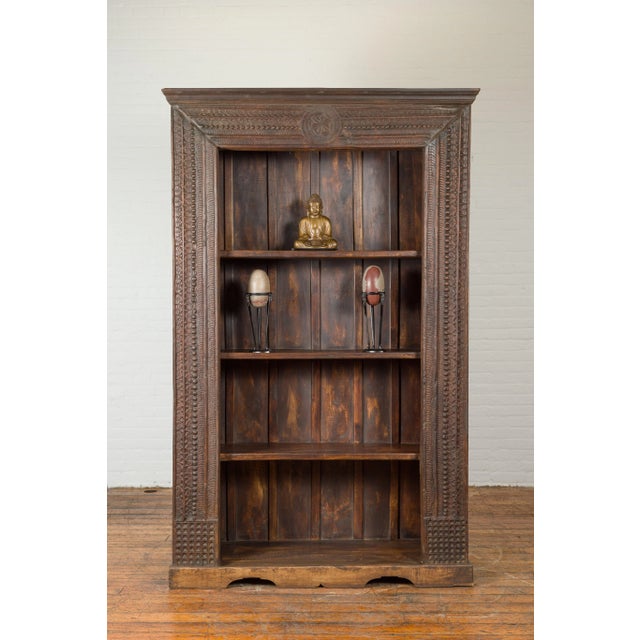 Chocolate 19th Century Indian Wooden Bookcase from Gujarat with Carved Friezes and Rosette For Sale - Image 8 of 13