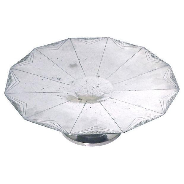 Art Deco silverplate and wood cake plate with etched Deco-style geometric sun ray design and inverted step-neck design....