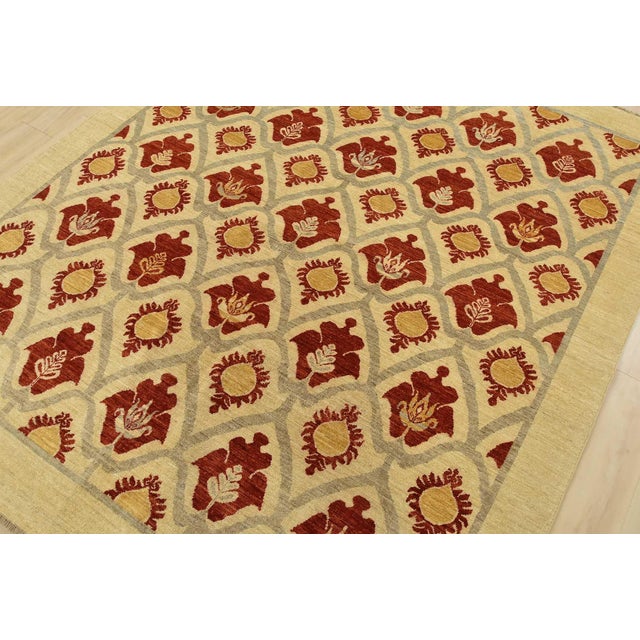A traditional Suzani rug hand-knotted with fine wool on a cotton foundation. This rug features an all-over botanical...