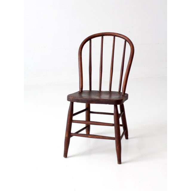 Late 19th-century American Windsor bow back chair with a beautifully aged finish and richly developed patina. The...