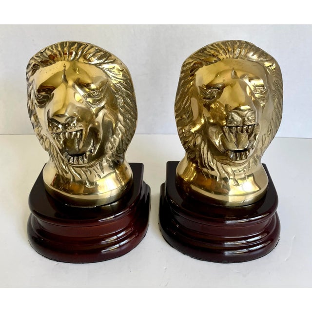 Here is an amazing set of matching lion bookends made of brass and rosewood. The lions are shown with their teeth bared! I...