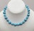 1960s single strand rhodium plated alternating round and oblong spiral faux-turquoise beads with small round rhodium...