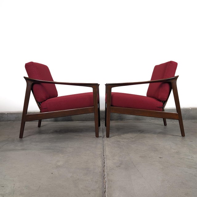 An iconic pair of Scandinavian Modern lounge chairs designed by Folke Ohlsson for DUX as part of the celebrated Monterey...