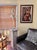 A large "widow's walk" architectural element in painted iron mounted to a painted wood base. The paint has weathered to...