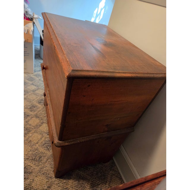 This piece is an antique primitive lift-top commode/washstand. The piece is an excellent example of primitive living,...