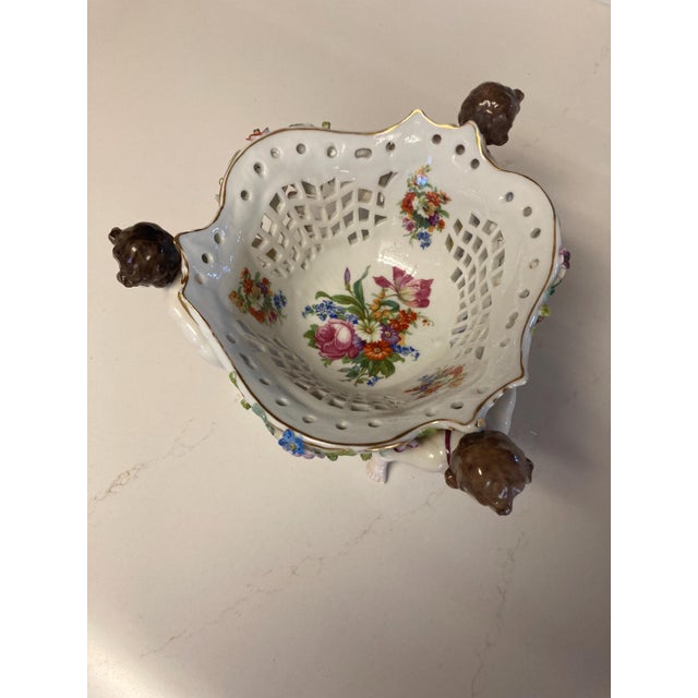 This beautiful, unique china centerpiece basket made in Germany is adorned with cherubs and flowers. Please note the...