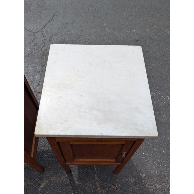 This exquisite pair of antique French oak nightstands brings a commanding touch of provincial elegance and timeless...