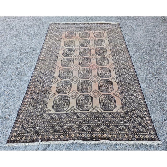 In this listing you will find a magnificent XL Antique Ersari rug. It features a triple pattern chain through the center....