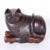 Anglo Indian carved mahogany cat with ebonized stripes and a curious expression, featuring a secret compartment on the...