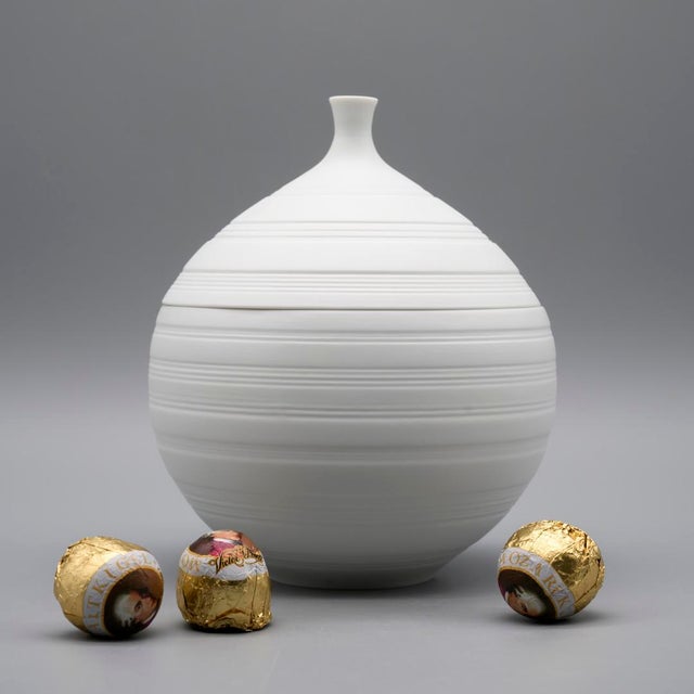 Spherical lidded box designed by Hans Achtziger for Hutschenreuther in Germany during the 1970s. Made from soft-white...