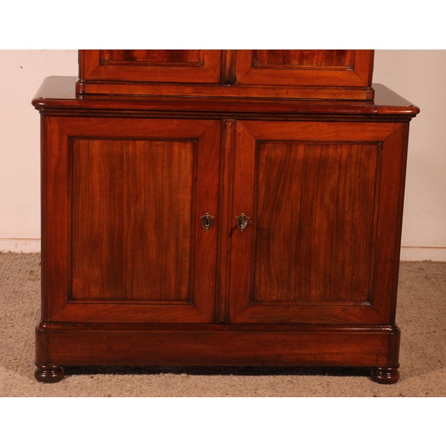Charming small two-part miniature buffet in solid mahogany from the early 19th century. This interesting buffet is unusual...