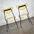 Lovely pair of mid-century modern Neva-Rust patio dining chairs by Salterini comprised of their original yellow linen...