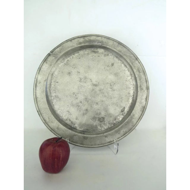 English large pewter charger plate great patina and late hook. 16" diameter 18th century There are some other chargers...