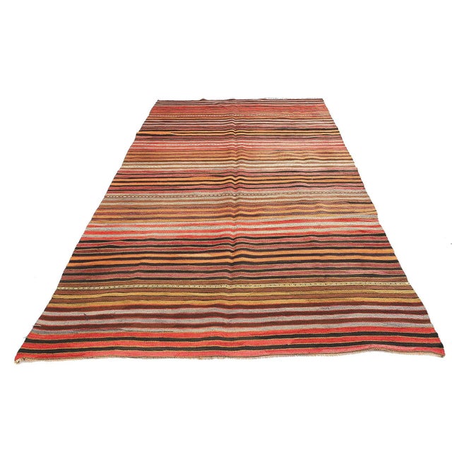 Handwoven vintage striped kilim rug from Denizli region of Turkey. Approximatelly 45-55 years old. In very good condition.