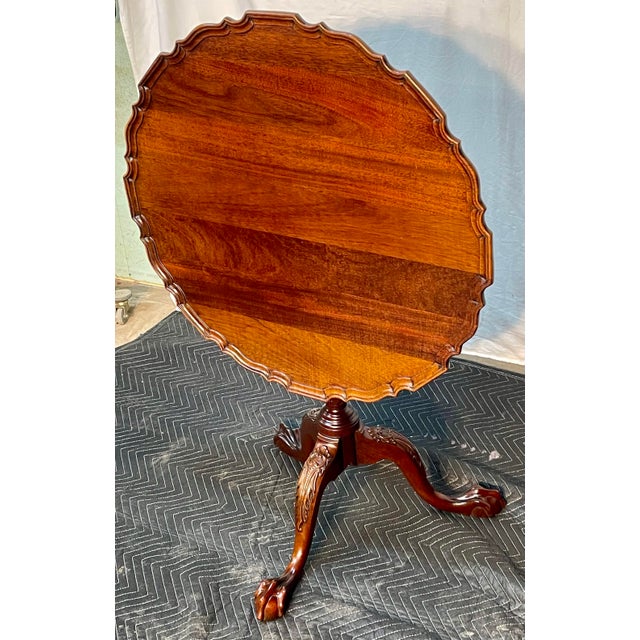 Presenting a masterwork of American craftsmanship: the L & J. G. Stickley Mahogany "Pie-Crust" Tilt-Top Tea Table. The...