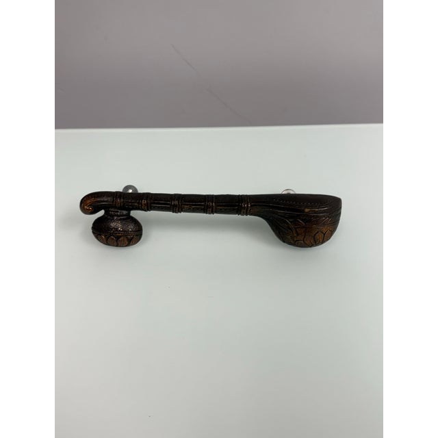 Design Plus Gallery presents a Brass Sitar-Shaped Door Handle. This decorative brass door handle takes inspiration from...