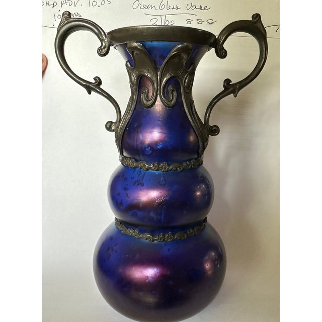 Here we have a triple corset vase with pewter belts on each third , a purple glass with silver crystal inclusions , not...