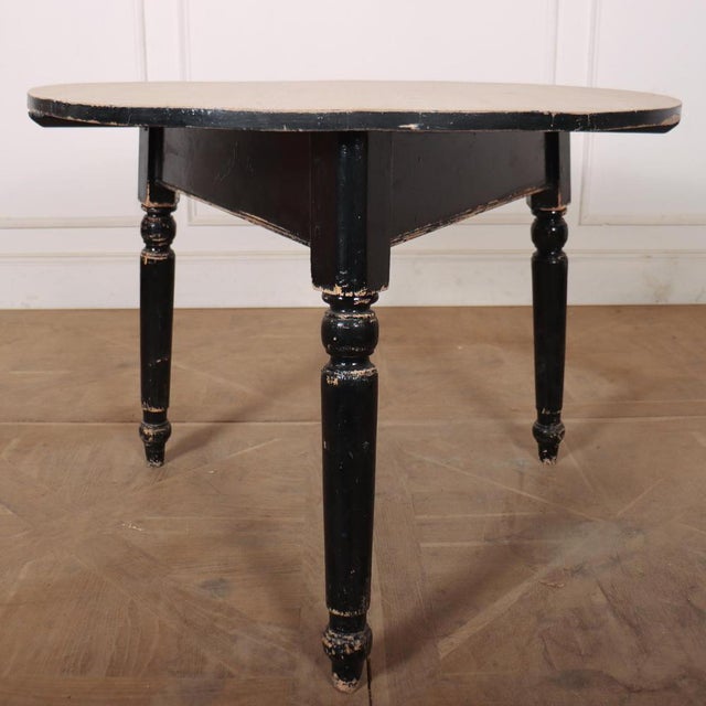 Large 19th Century Welsh pine cricket table with a scrubbed top and original black painted base. 1850. This piece is...
