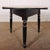 Large 19th Century Welsh pine cricket table with a scrubbed top and original black painted base. 1850. This piece is...