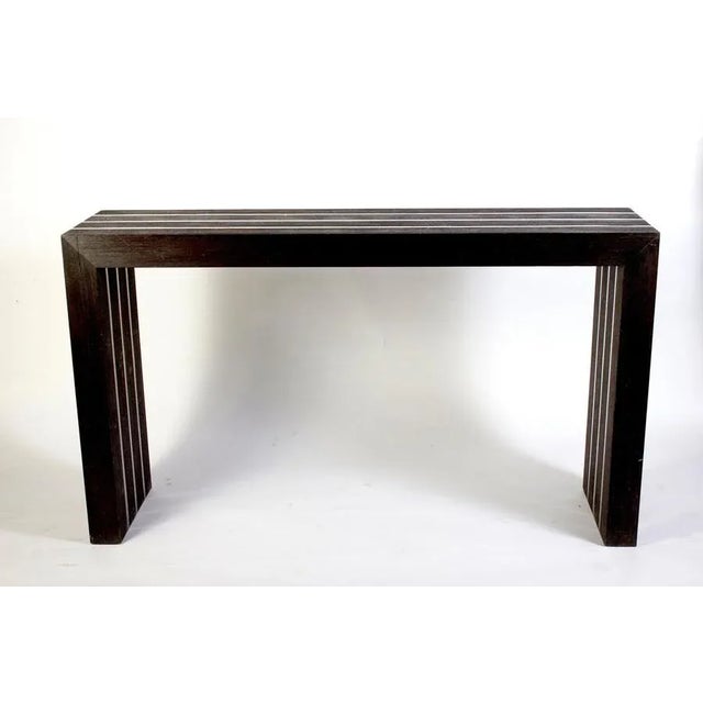 Italian modernist dark wood and steel insert console table.