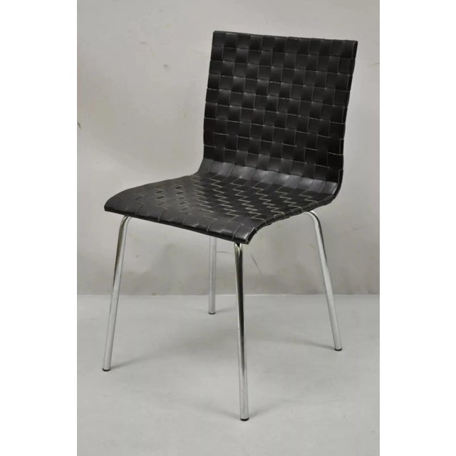 Contemporary Modern Black Woven Leather Chrome Frame Dining Chairs - Set of 4. Circa Late 20th Century. Measurements:...