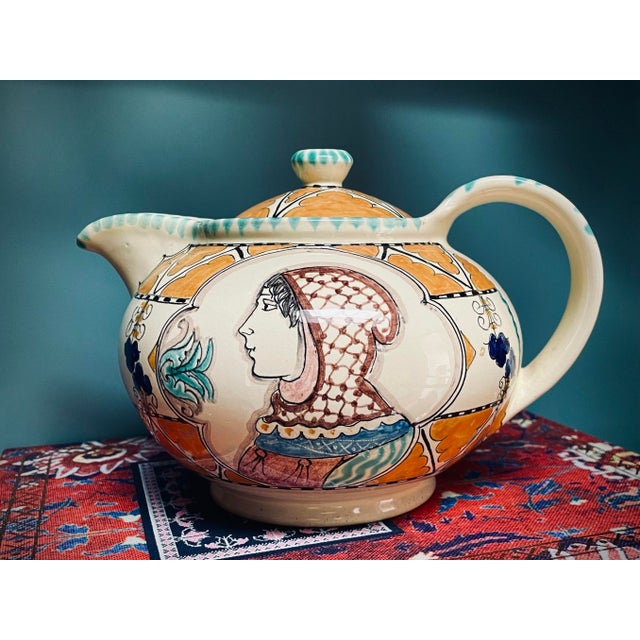 Vintage Renaissance style hand painted teapot features a portrait of a man on one side and a woman on the other with...