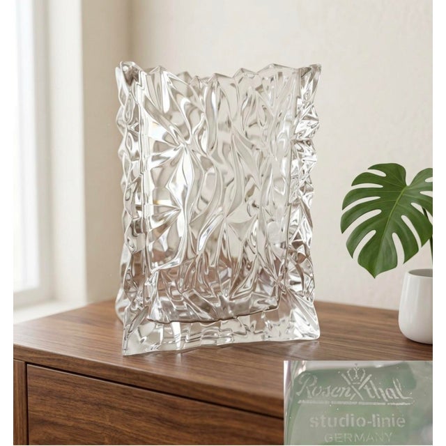 A sculptural vintage Rosenthal Studio-Line crystal vase featuring a distinctive crumpled paper bag form. The richly...