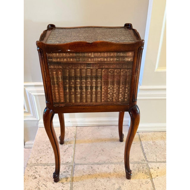 Theodore Alexander Petite Louis XVI Side Table with Faux Book Trompe l'Oeil Panels This Theodore Alexander side table is a...