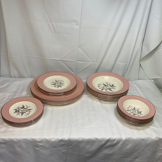 Elevate your tablescape with a classic touch of 1950s Americana. This 25-piece vintage dinnerware collection from renowned...