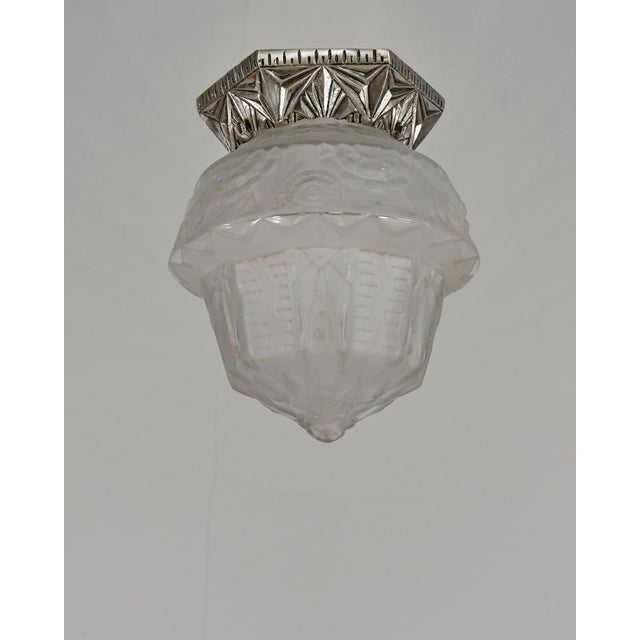 Francis Hubens & Muller frères A pair of French art deco flush mounts by Francis Hubens. Made around 1931- 1934. Nickel-...