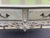 This painted French console table is beautifully carved. Throughout this piece you will find delicate carvings of shells,...