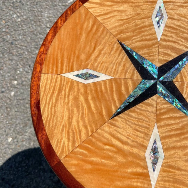 Artisan Crafted Specimen Compass Table A stunning table inlaid with abalone shell, mother of pearl, and marble to form a...