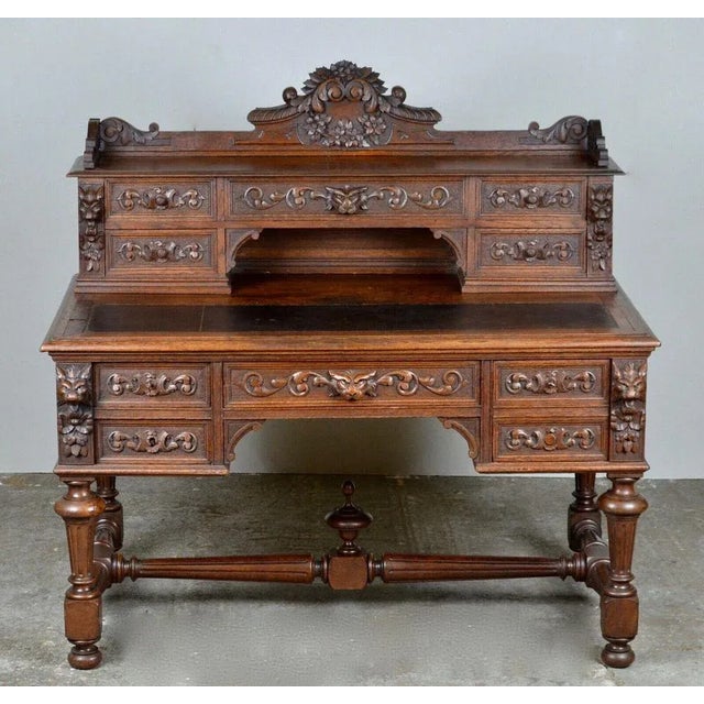 We are delighted to offer for sale this 19th century heavily carved dark oak kneehole desk. An impressive green man desk...