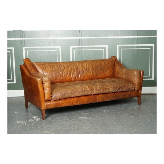 Stunning Vintage Tan Leather Contemporary Designer Sofa. The sofa is very comfortable and can easily sit 3 to 4 people....