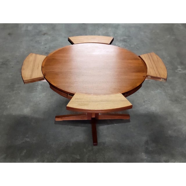 Danish Flip Flap Lotus Dining Table from Dyrlund, 1960, in Very Good conditions. Designed 1960 to 1969 This piece has an...