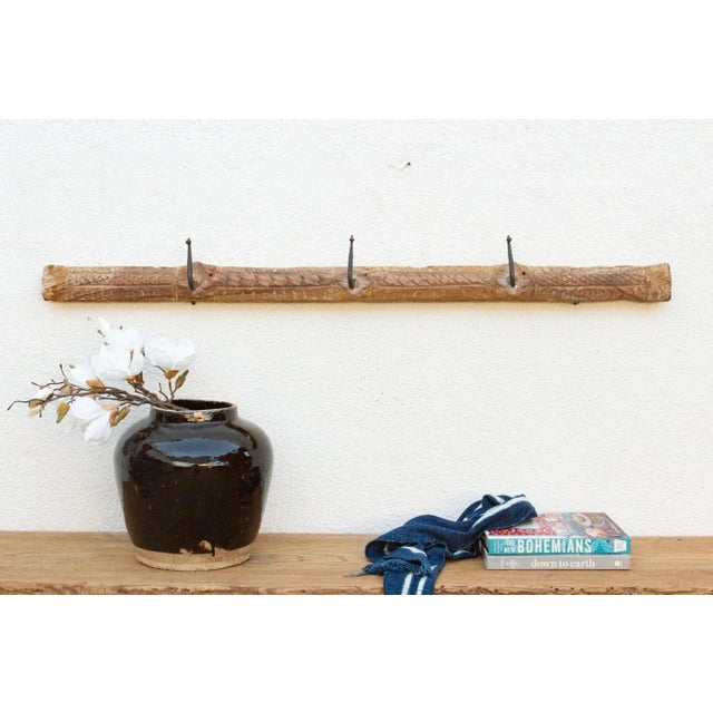 Add a touch of rustic charm to your home with this unique wall hook. Crafted from an antique southern Indian door lintel,...