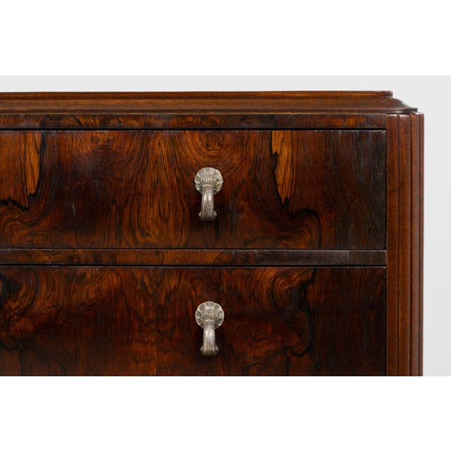 Elegant French Art Deco commode from the 1930s, sourced in Paris, crafted in richly figured rosewood veneer over a solid...