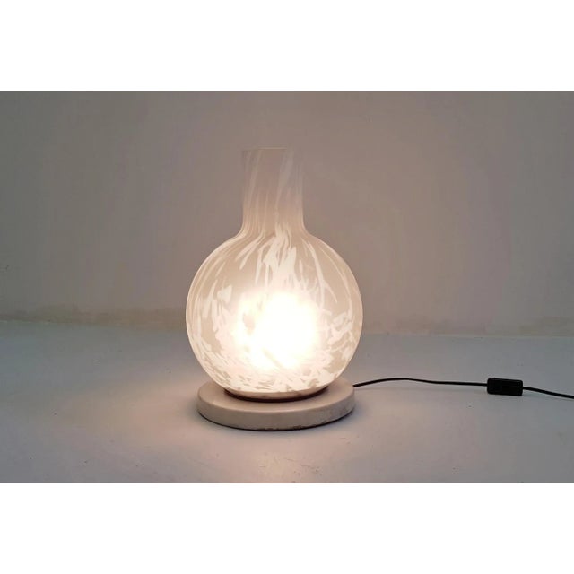 This is a cool vintage table or floor lamp made in Italy. The materials are white marble in the base with a frosted...