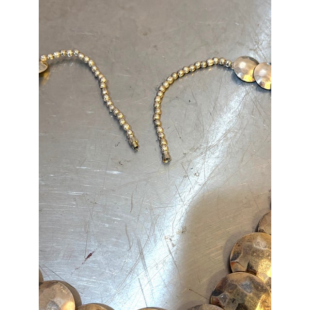 1980s-90s large silver-tone hammered disc/bead necklace w/ screw closure. Excellent condition.
