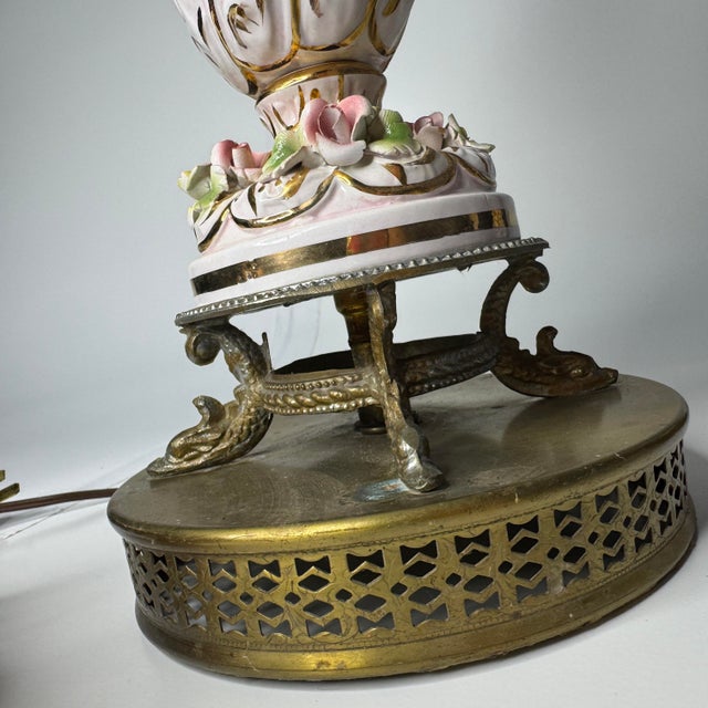 Beautiful pair of mid 20th century Italian Capodimonte porcelain table lamps featuring hand-painted romantic scenes,...