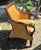 This is a Hollywood Regency or British Colonial style woven rattan wingback armchair. Structural and Design Highlights...