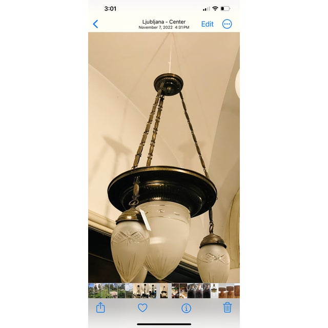 Antique Austrian Viennese chandelier. Three cut glass globes with center milk glass piece. 35” wide , 45” high. The hight...